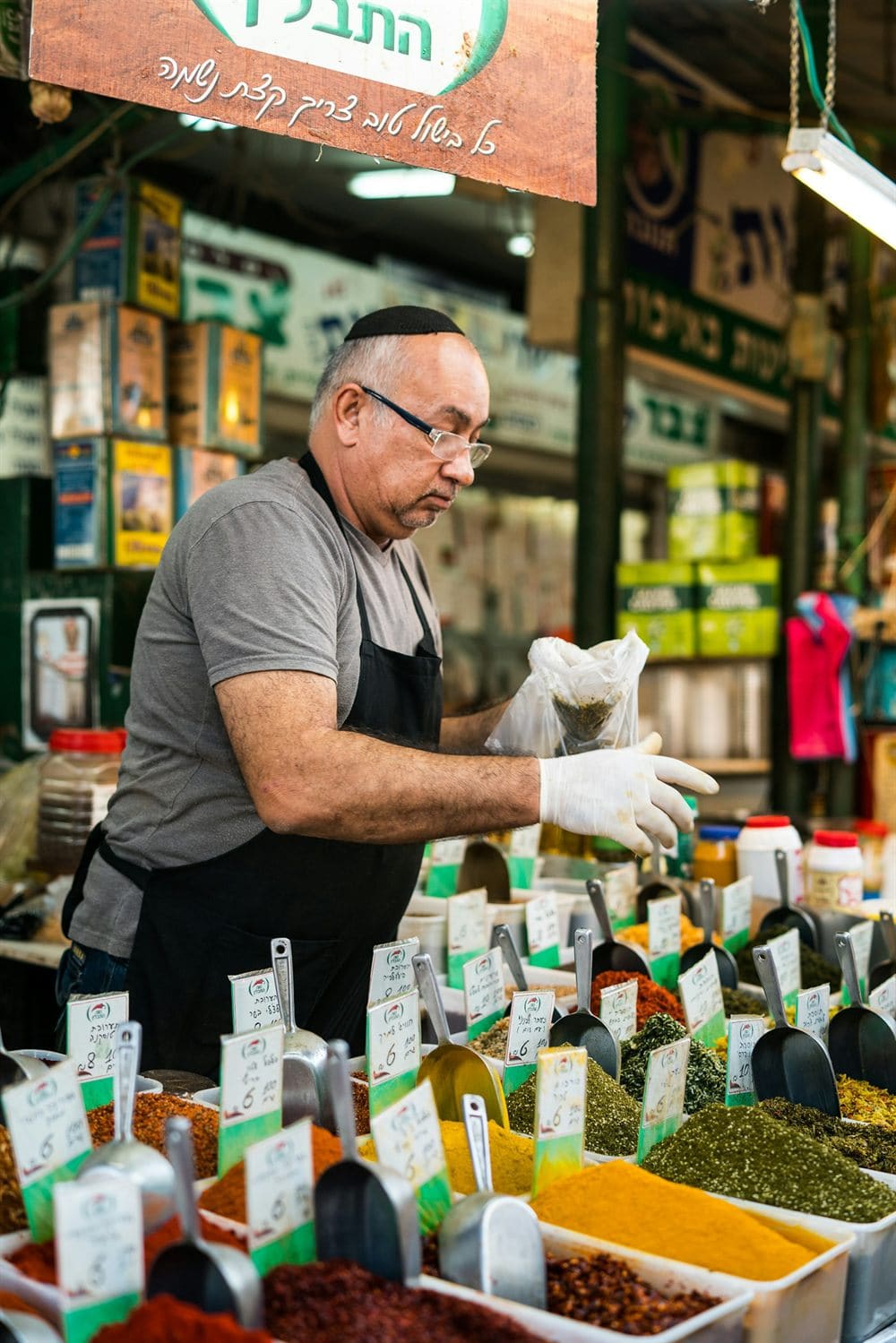A spice vendor at Tel Aviv's Carmel Market
